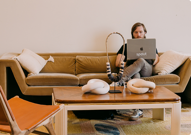 Member working on a laptop in The KINN lounge